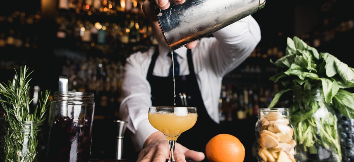 Bartender pouring cocktail