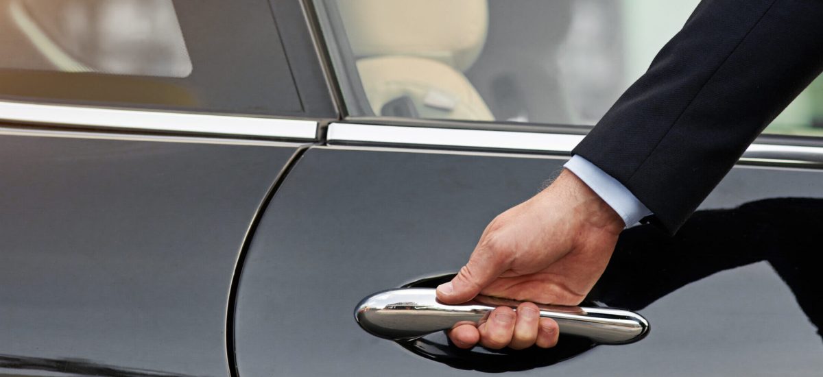 Businessman, hands and chauffeur driver by car door for travel accommodation or commute in the city. Hand of male person on vehicle handle in professional transport service, business class or pick up.